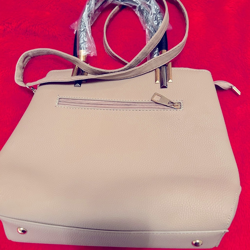 For sale crossbody bag. Tan and cream color